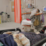 
              Patients lie on beds in the emergency room, turned into a CODIV-19 unit due the high number of cases, at the Bagdasar-Arseni hospital in Bucharest, Romania, Tuesday, Oct. 12, 2021. Romania reported on Tuesday nearly 17,000 new COVID-19 infections and 442 deaths, the highest number of coronavirus infections and deaths in a day since the pandemic started, as the nation's health care system struggles to cope with an acute surge of new cases.(AP Photo/Andreea Alexandru)
            