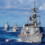 
              In this photo released by Defense Visual Information Distribution Service, ships from Japan Maritime Self-Defense Force and Indian Navy sail in formation with Royal Australian Navy HMAS Warramunga and Arleigh Burke-class guided-missile destroyer USS Barry (DDG 52) during MALABAR 2021 on Aug. 27, 2021. China seeks to bring the strategically and symbolically important island back under its control, and the U.S. sees Taiwan in the context of broader challenges from China. (Justin Stack/DVIDS U.S. Navy via AP)
            