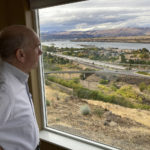 
              In this Tuesday, Oct. 5, 2021, photo, The Dalles Mayor Richard Mays looks at the view of his town and the Columbia River from his hilltop home in The Dalles, Oregon. Mays helped negotiate a proposal by Google to build new data centers in the town. The data centers require a lot of water to cool their servers, and would use groundwater and surface water, but not any water from the Columbia River. (AP Photo/Andrew Selsky)
            