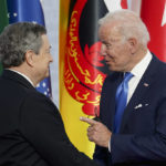 
              U.S. President Joe Biden, right, speaks with Italy's Prime Minister Mario Draghi as he arrives at the La Nuvola conference center for the G20 summit in Rome, Saturday, Oct. 30, 2021. The two-day Group of 20 summit is the first in-person gathering of leaders of the world's biggest economies since the COVID-19 pandemic started. (Kevin Lamarque/Pool Photo via AP)
            