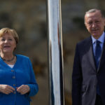 
              German Chancellor Angela Merkel, left, is welcomed by Turkish President Recep Tayyip Erdogan on the occasion of their meeting at Huber Villa presidential palace, in Istanbul, Turkey, Saturday, Oct. 16, 2021. (AP Photo/Francisco Seco)
            