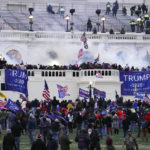 
              FILE - In this Jan. 6, 2021 file photo, violent protesters, loyal to President Donald Trump, storm the Capitol in Washington. A House committee tasked with investigating the Jan. 6 Capitol insurrection is moving swiftly to hold at least one of Donald Trump’s allies, former White House aide Steve Bannon, in contempt. That's happening as the former president is pushing back on the probe in a new lawsuit. (AP Photo/John Minchillo)
            