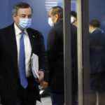 
              Italy's Prime Minister Mario Draghi arrives for an EU summit in Brussels, Friday, Oct. 22, 2021. European Union leaders conclude a two-day summit on Friday in which they discuss issues such as climate change, the energy crisis, COVID-19 developments and migration. (Olivier Hoslet, Pool Photo via AP)
            