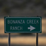 
              A sign stands near the Bonanza Creek Film Ranch in Santa Fe, N.M., Saturday, Oct. 23, 2021.  An assistant director unwittingly handed actor Alec Baldwin a loaded weapon and told him it was safe to use in the moments before the actor fatally shot a cinematographer, court records released Friday show.  (AP Photo/Jae C. Hong)
            