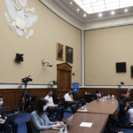 
              Darren Woods, CEO of ExxonMobil, testifies via video conference during a House Committee on Oversight and Reform hearing on the role of fossil fuel companies in climate change, Thursday, Oct. 28, 2021, on Capitol Hill in Washington. (AP Photo/Jacquelyn Martin)
            