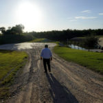 
              Tomas De Leon, foreman of the Hidalgo County Irrigation District #3 pump station, walks along a canal that feeds water from the Rio Grande, Tuesday, Sept. 14, 2021, in Hidalgo, Texas. Under a 1944 treaty, Mexico and the U.S. share water from the Rio Grande for use in agriculture, industries and households. Since then, the border cities of McAllen, Brownsville, Reynosa and Matamoros have ballooned — along with their water needs. (AP Photo/Eric Gay)
            