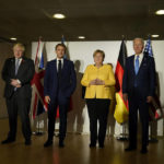
              From right, U.S. President Joe Biden, German Chancellor Angela Merkel, French President Emmanuel Macron and British Prime Minister Boris Johnson pose prior to a meeting on the sidelines of the G20 summit in Rome, Saturday, Oct. 30, 2021. The two-day Group of 20 summit is the first in-person gathering of leaders of the world's biggest economies since the COVID-19 pandemic started. (AP Photo/Evan Vucci)
            
