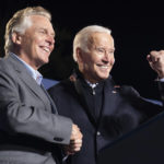 
              President Joe Biden, right, reacts after speaking at a rally for Democratic gubernatorial candidate, former Virginia Gov. Terry McAuliffe, Tuesday, Oct. 26, 2021, in Arlington, Va. McAuliffe will face Republican Glenn Youngkin in the November election. (AP Photo/Alex Brandon)
            