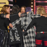 
              The Go-Go's hug their presenter, actress Drew Barrymore, after she inducted them into the Rock & Roll Hall of Fame during the induction ceremony, Saturday, Oct. 30, 2021, in Cleveland. (AP Photo/David Richard)
            
