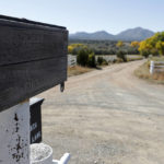 
              An old wooden sign is seen at the entrance of the Bonanza Creek Film Ranch headquarters in Santa Fe, N.M., Friday, Oct. 22, 2021. Actor Alec Baldwin fired a prop gun on the set of a Western being filmed at the ranch on Thursday, Oct. 21, killing the cinematographer, officials said. The director of the movie was wounded, and authorities were investigating. (AP Photo/Andres Leighton)
            