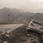 
              An abandoned car is stuck in the mud on Chualar River Road as rain falls over Salinas Valley, Calif., Monday, Oct. 25, 2021. (AP Photo/Nic Coury)
            