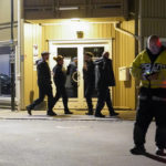
              Police work at the scene where an arrow was shot into a wall in Kongsberg, Norway, Wednesday, Oct. 13, 2021. A man armed with a bow and arrows killed several people Wednesday near the Norwegian capital of Oslo before he was arrested, authorities said. (Torstein Bøe/NTB via AP)
            