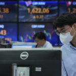 
              A currency trader watches monitors at the foreign exchange dealing room of the KEB Hana Bank headquarters in Seoul, South Korea, Friday, Oct. 15, 2021. Asian shares were higher Friday after technology companies powered the biggest gain on Wall Street since March. (AP Photo/Ahn Young-joon)
            