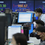 
              Currency traders watch monitors at the foreign exchange dealing room of the KEB Hana Bank headquarters in Seoul, South Korea, Friday, Oct. 15, 2021. Asian shares were higher Friday after technology companies powered the biggest gain on Wall Street since March. (AP Photo/Ahn Young-joon)
            
