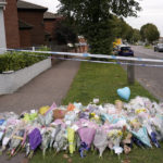 
              A floral tribute lies by the cordoned off area where a member of Parliament was killed on Friday, in Leigh-on-Sea, Essex, England, Saturday, Oct. 16, 2021. David Amess, a long-serving member of Parliament was stabbed to death during a meeting with constituents at a church in Leigh-on-Sea on Friday, in what police said was a terrorist incident. A 25-year-old British man is in custody. (AP Photo/Alberto Pezzali)
            