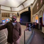 Dan Reinharz, Neptune manager, says decorative windows in the Neptune Theatre are made from plastic -- not stained glass. (Feliks Banel/KIRO Radio)