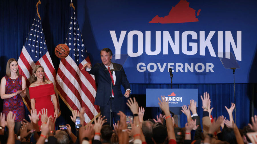 Virginia Republican gubernatorial candidate Glenn Youngkin shoots an autographed basketball into th...