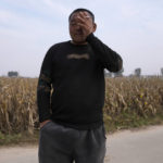 
              Qin Shixian reacts while talking about the impact of the floods in Zhaoguo village in central China's Henan province on Friday, Oct. 22, 2021. The flooding disaster in July is the worst that older farmers can remember in 40 years – but it is also a preview of the kind of extreme conditions the country is likely to face as the planet warms up, and weather patterns farmers depend upon are increasingly destabilized. (AP Photo/Ng Han Guan)
            