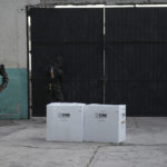 
              Soldiers guard boxes of electoral ballots after the closing of a voting center during general elections in Tegucigalpa, Honduras, Sunday, Nov. 28, 2021. The National Electoral Council called on political parties to refrain from declaring their candidates victorious or providing partial vote totals while voting was ongoing. (AP Photo/Moises Castillo)
            