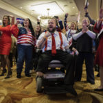 
              People cheer the incoming results at the election night party for Republican gubernatorial candidate Jack Ciattarelli, held at the Bridgewater Marriott hotel in Bridgewater, N.J., Tuesday, Nov. 2, 2021. (AP Photo/Stefan Jeremiah)
            