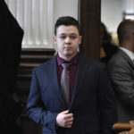 
              Kyle Rittenhouse enters the courtroom to hear the verdicts in his trial  at the Kenosha County Courthouse in Kenosha, Wis., on Friday, Nov. 19, 2021.  Rittenhouse has been acquitted of all charges after pleading self-defense in the deadly Kenosha shootings that became a flashpoint in the nation’s debate over guns, vigilantism and racial injustice. The jury came back with its verdict afer close to 3 1/2 days of deliberation. (Sean Krajacic/The Kenosha News via AP, Pool)
            