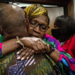 
              Ahmaud Arbery's mother, Wanda Cooper-Jones his hugged by a supporter after the jury convicted Travis McMichael in the trial of McMichael, his father, Greg McMichael, and neighbor, William "Roddie" Bryan, Wednesday, Nov. 24, 2021, in the Glynn County Courthouse in Brunswick, Ga. The three defendants were found guilty Wednesday in the death of Ahmaud Arbery. (AP Photo/Stephen B. Morton, Pool)
            