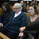 
              From left, Kariann Swart, Joseph Rosenbaum's fiancee, Susan Hughes, Anthony Huber's great aunt, and Hannah Gittings, Anthony Huber's girlfriend, listen as Kyle Rittenhouse is found not guilty on all counts at the Kenosha County Courthouse in Kenosha, Wis., on Friday, Nov. 19, 2021.  The jury came back with its verdict after close to 3 1/2 days of deliberation.  (Sean Krajacic/The Kenosha News via AP, Pool)
            