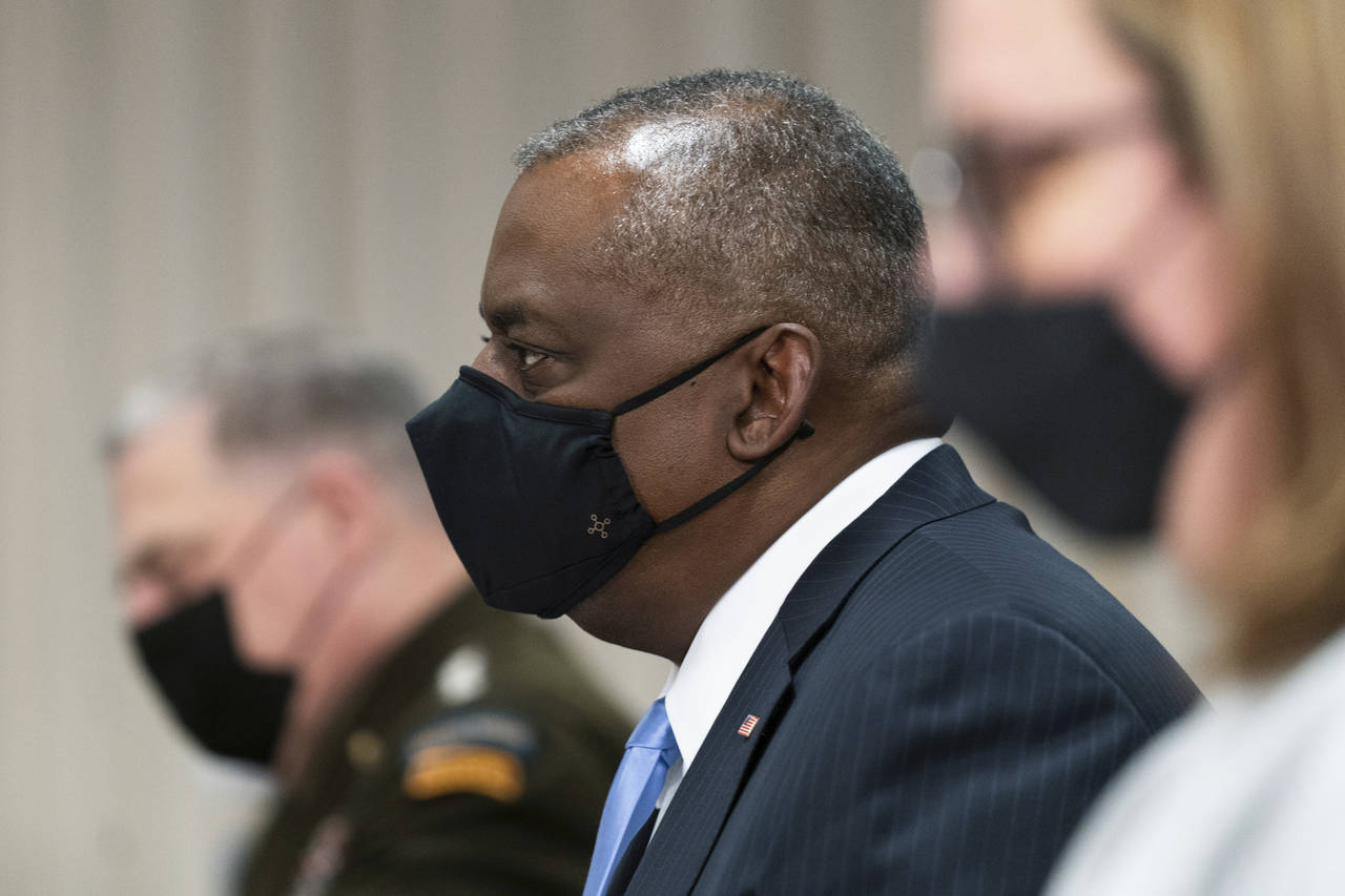 Defense Secretary Lloyd Austin with Chairman of the Joint Chiefs of Staff Gen. Mark Milley, left, s...