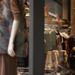 
              A woman looks at clothes inside a store on Oxford Street in London, Monday, Nov. 29, 2021. Countries around the world slammed their doors shut again to try to keep the new omicron variant at bay Monday, even as more cases of the mutant coronavirus emerged and scientists raced to figure out just how dangerous it might be. In Britain, mask-wearing in shops and on public transport will be required, starting Tuesday. (AP Photo/Matt Dunham)
            