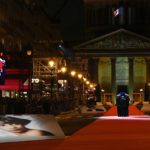 
              Pictures of Josephine Baker adorn the red carpet as the coffin with soils from the U.S., France and Monaco is carried towards the Pantheon monument in Paris, France, Tuesday, Nov. 30, 2021, where Baker is to symbolically be inducted, becoming the first Black woman to receive France's highest honor. Her body will stay in Monaco at the request of her family. (AP Photo/Christophe Ena)
            