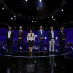 
              Chilean presidential candidates, from left, Gabriel Boric from the Apruebo Dignidad coalition party, Jose Antonio Kast from the Partido Republicano, Yasna Provoste from the Unidad Constituyente party, Sebastián Sichel of the center-right government coalition, Eduardo Artes of the Partido Comunista-Acción Proletaria y Unión Patriótica, and Marco Henriquez-Ominami from the left-wing Progressive Party, pose for a photo prior to the presidential debate in Santiago, Chile, Monday, Nov. 15, 2021. Chile will hold its presidential election on Nov. 21. (AP Photo/Esteban Felix, Pool)
            