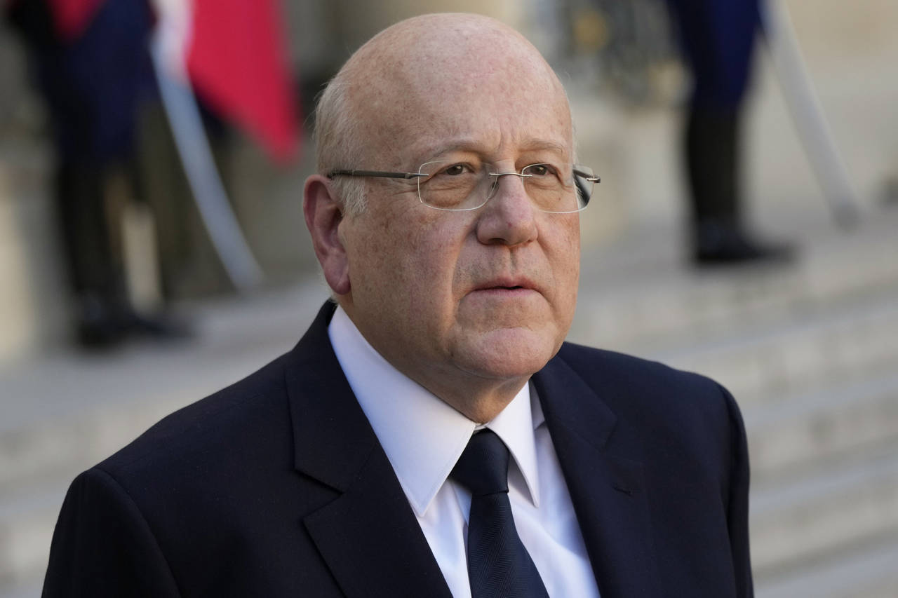 Lebanese Prime Minister Najib Mikati attends a joint press conference with French President Emmanue...