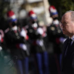 
              Prince Albert II of Monaco stands for the Monaco national anthem, during a ceremony honoring Joesphine Baker at the Monaco-Louis II Cemetery in Monaco, Monday, Nov. 29, 2021. France is inducting Missouri-born cabaret dancer Josephine Baker who was also a French World War II spy and civil rights activist into its Pantheon. She is the first Black woman honored in the final resting place of France’s most revered luminaries. A coffin carrying soils from places where Baker made her mark will be deposited Tuesday inside the domed Pantheon monument overlooking the Left Bank of Paris. (AP Photo/Daniel Cole)
            