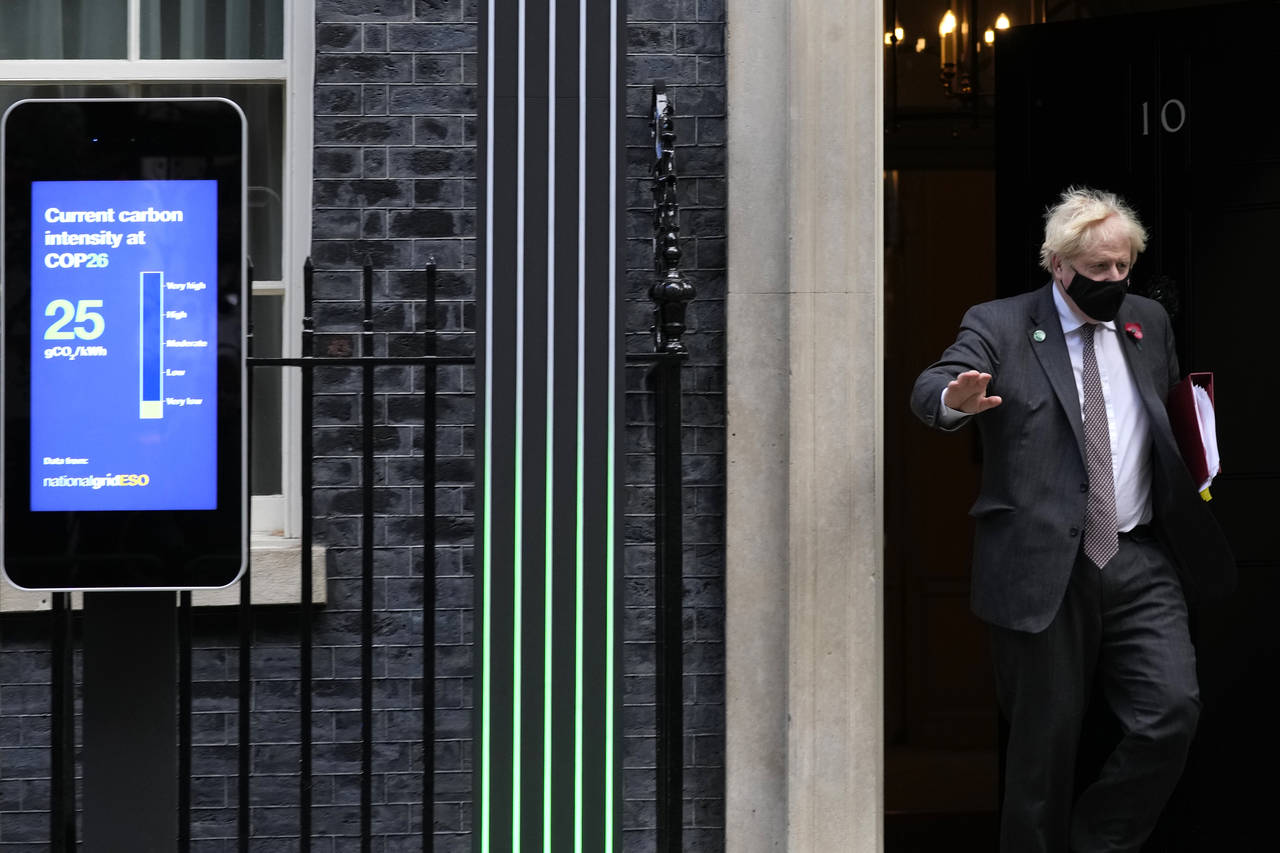 Britain's Prime Minister Boris Johnson leaves 10 Downing Street to attend the weekly session of Pri...