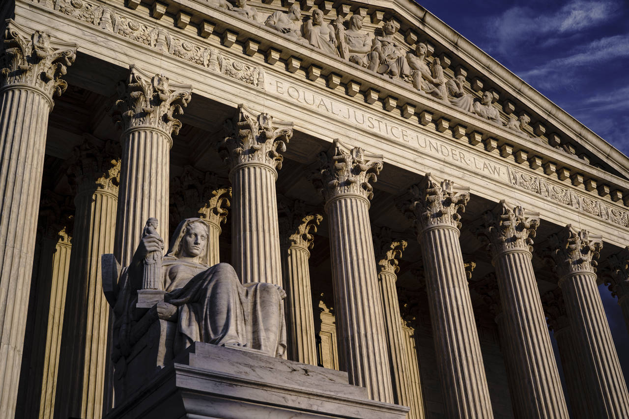 FILE - The Supreme Court is seen at dusk in Washington, Oct. 22, 2021. Both sides are telling the S...