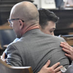 
              Kyle Rittenhouse hugs one of his attorneys, Corey Chirafisi, after he is found not guilty on all counts at the Kenosha County Courthouse in Kenosha, Wis., on Friday, Nov. 19, 2021.  The jury came back with its verdict afer close to 3 1/2 days of deliberation.  (Sean Krajacic/The Kenosha News via AP, Pool)
            