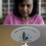 
              Ranjana Bhandari, executive director of Liveable Arlington, works on a laptop at her home in Arlington, Texas, on Tuesday, Oct. 26, 2021. More than a decade ago, Bhandari and her neighbors convinced an oil and gas company to locate a natural gas drill site farther away from their homes. Now she is helping residents in other Arlington neighborhoods, particularly those with fewer resources, to do the same. She has taken particular aim at TEP Barnett, a subsidiary of French energy giant Total Energies, which has 33 well sites in Arlington and more in neighboring communities. (AP Photo/Martha Irvine)
            