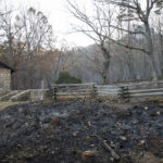 
              Most of the structures and fences at Pilot Mountain State Park remain standing after the wildfire caused damage to over 1,000 acres by Tuesday, Nov. 30, 2021, in Pinnacle, N.C. (Allison Lee Isley/The Winston-Salem Journal via AP)
            