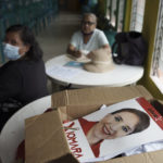 
              Posters of the Free Party presidential candidate Xiomara Castro sit inside a box prior to an election observers meeting in the Kennedy neighborhood of Tegucigalpa, Honduras, Friday, Nov. 26, 2021. Honduras will hold general election on Nov. 28. (AP Photo/Moises Castillo)
            