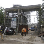 
              Rescue workers at the site of the collapsed 21-story apartment building under construction in Lagos, Nigeria, Tuesday, Nov. 2, 2021. Authorities in Nigeria's largest city say the owner of a high-rise apartment building that collapsed suddenly has been arrested. The news came Tuesday as officials announced that 14 people had been confirmed dead following Monday's accident. Dozens of others are believed to still be trapped in the rubble of the 21-story building that was under construction in the Ikoyi area of Lagos. (AP Photo/Sunday Alamba)
            