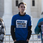 
              Parkland survivor and activist David Hogg stands during a rally outside of the U.S. Supreme Court in Washington, Wednesday, Nov. 3, 2021. The Supreme Court is set to hear arguments in a gun rights case that centers on New York's restrictive gun permit law and whether limits the state has placed on carrying a gun in public violate the Second Amendment. (AP Photo/Jose Luis Magana)
            