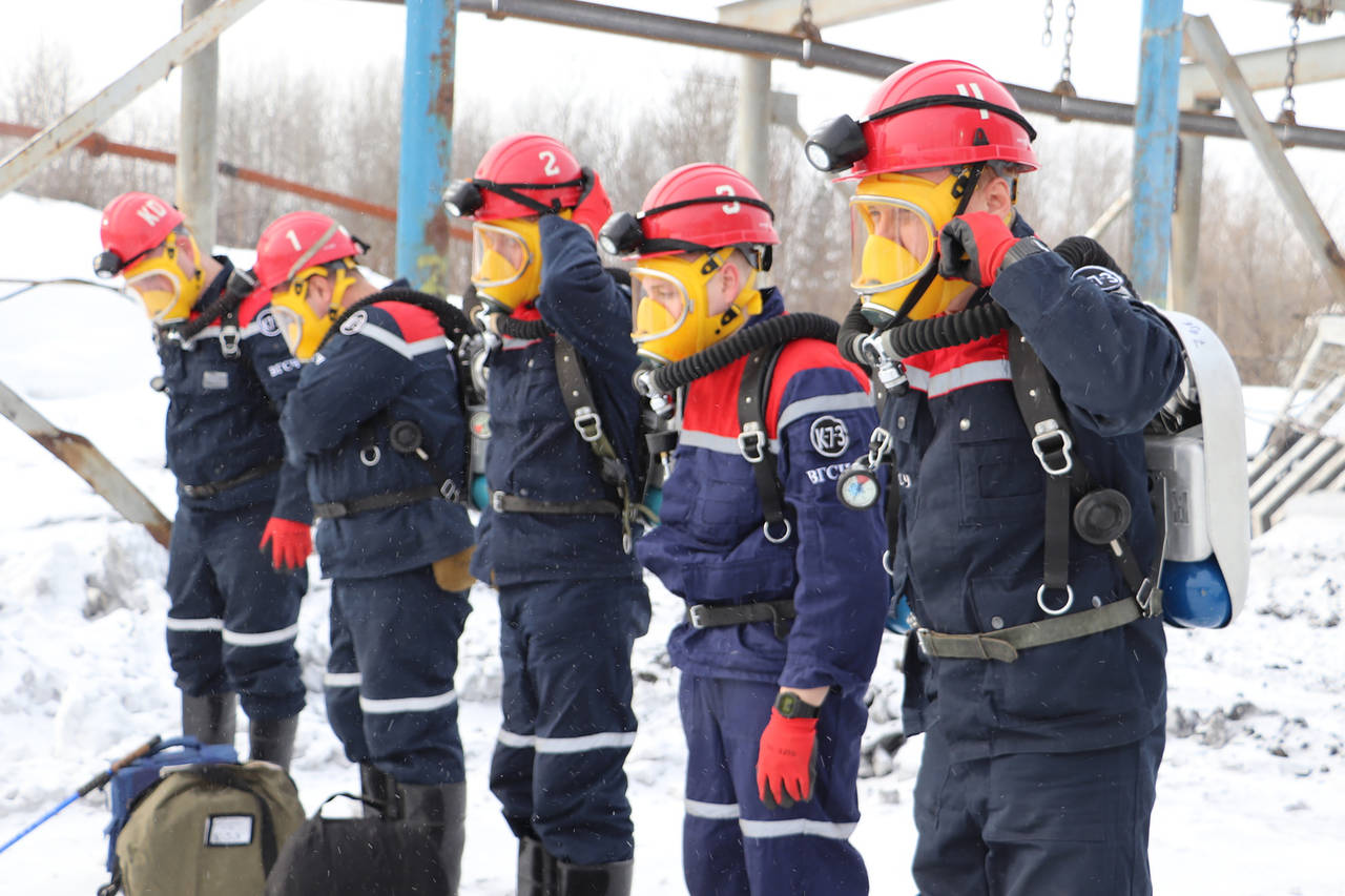 In this Russian Emergency Situations Ministry Thursday, Nov. 25, 2021 photo, rescuers prepare to wo...