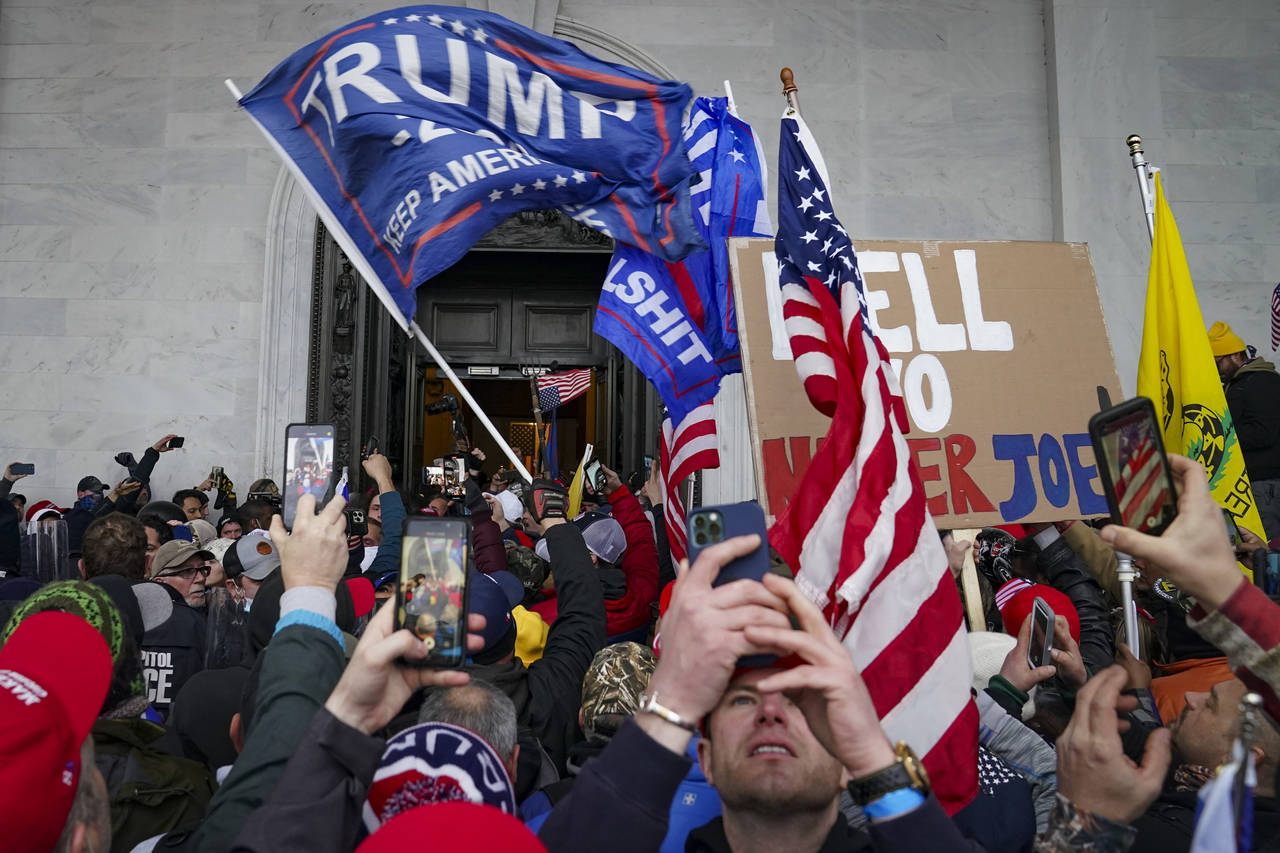 FILE - In this Jan. 6, 2021, photo, insurrections loyal to President Donald Trump riot outside the ...