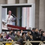 
              Faithful listen to Pope Francis' Angelus prayer in St. Peter's Square at the Vatican, Sunday, Nov. 28, 2021.(AP Photo/Gregorio Borgia)
            