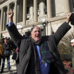 
              Jeff Jared, of Seattle, reacts to the verdict outside the Kenosha County Courthouse, Friday, Nov. 19, 2021 in Kenosha, Wis. Kyle Rittenhouse was acquitted of all charges after pleading self-defense in the deadly Kenosha shootings that became a flashpoint in the nation's debate over guns, vigilantism and racial injustice. (AP Photo/Paul Sancya)
            