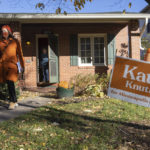 
              Mayoral candidate Kate Knuth knocks on doors to invite people to vote on Tuesday, Nov. 2, 2021 in Minneapolis. Voters in Minneapolis are deciding whether to replace the city's police department with a new Department of Public Safety. The election comes more than a year after George Floyd's death launched a movement to defund or abolish police across the country.(AP Photo/Christian Monterrosa)
            