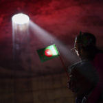 
              A Bangladeshi man carries his granddaughter holding their national flag inside the Museum of Independence during celebrations to mark 50 years of victory over Pakistan, at an event in Dhaka, Bangladesh, Thursday, Dec. 16, 2021. On Dec. 16, 1971, Pakistani soldiers surrendered to a joint India-Bangladesh force, formally making Bangladesh a new nation under the leadership of independence leader Sheikh Mujibur Rahman, the father of current Prime Minister Sheikh Hasina. (AP Photo/Mahmud Hossain Opu)
            