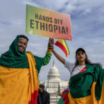 
              FILE - Ethiopian and Eritrean origin people, supporters of Ethiopian Prime Minister Abiy Ahmed participate in a protest against the U.S. and other western countries intervention in their country and calling for the immediate end to Ethiopia's ongoing internal conflict in Washington, on Dec. 10, 2021. A new poll from MTV and The Associated Press-NORC Center for Public Affairs Research shows a broader trend among millennials and Generation Z who say they are more likely to be optimistic about the future and their ability to create change than their older counterparts. (AP Photo/Gemunu Amarasinghe, File)
            
