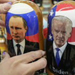 
              A customer shows to photographer a traditional Russian wooden dolls called Matreska of Russian President Vladimir Putin, center, and U.S. President Joe Biden, center right, at a souvenirs store in Moscow, Russia, Monday, Dec. 6, 2021. The Kremlin says President Joe Biden and Russian President Vladimir Putin will speak in a video call Tuesday. (AP Photo/Pavel Golovkin)
            