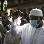 
              Gambian President Adama Barrow leaves the polling station after casting his vote in Gambia's presidential elections in Banjul, Gambia, Saturday, Dec. 4, 2021. Gambians vote in a historic election that will for the first time not have former dictator Yahya Jammeh, who ruled for 22 years, on the ballot. (AP Photo/Leo Correa)
            